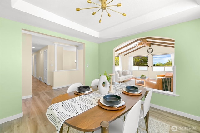 801 38th St, Bellingham, WA 98229 - dining area with light wood-style floors, arched walkways, baseboards, and a chandelier