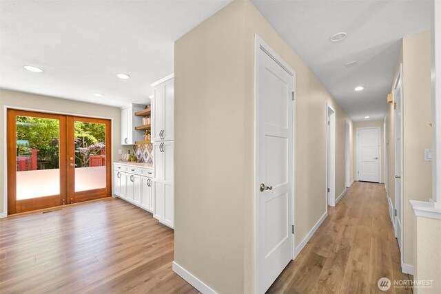 801 38th St, Bellingham, WA 98229 - corridor with light wood-style floors, french doors, baseboards, and recessed lighting
