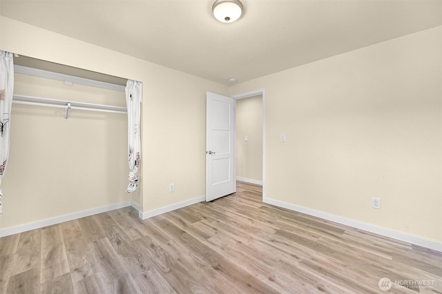 801 38th St, Bellingham, WA 98229 - unfurnished bedroom with light wood-style flooring, baseboards, and a closet