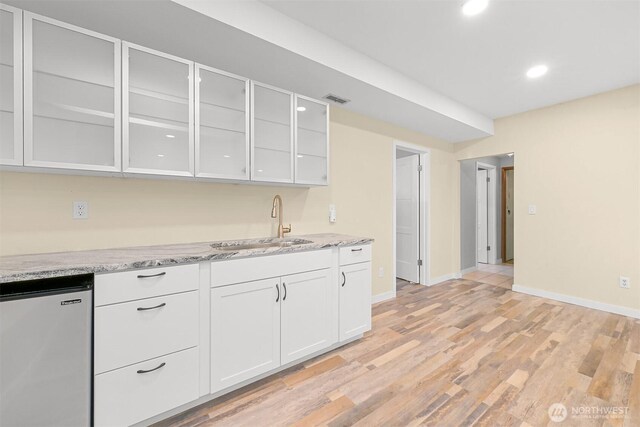 801 38th St, Bellingham, WA 98229 - kitchen featuring fridge, a sink, white cabinetry, light stone counters, and recessed lighting