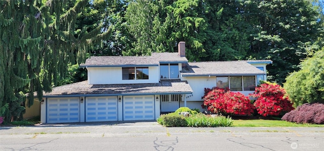 10622 44th Ave SE, Everett, WA 98208 - view of front facade with a chimney and an attached garage