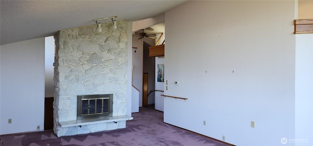 10622 44th Ave SE, Everett, WA 98208 - unfurnished living room with heating unit, carpet flooring, a stone fireplace, and ceiling fan