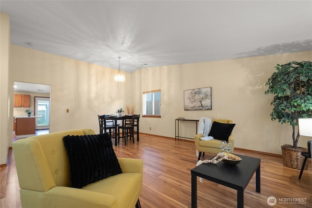 16215 NE 13th St, Vancouver, WA 98684 - living room featuring wood finished floors and a chandelier