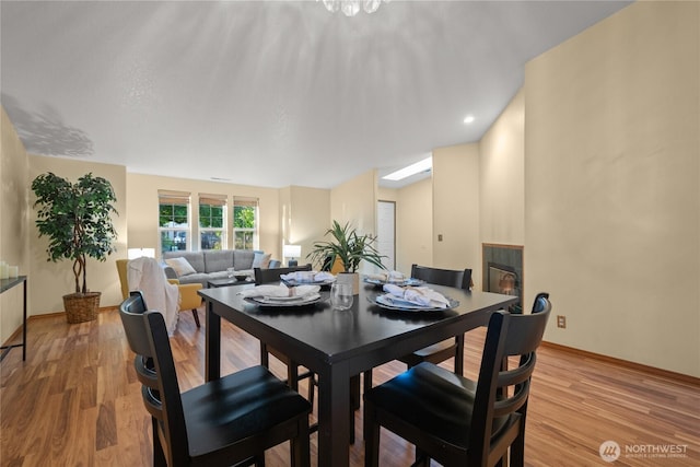 16215 NE 13th St, Vancouver, WA 98684 - dining room featuring light wood finished floors and a glass covered fireplace