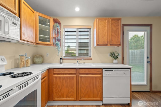 16215 NE 13th St, Vancouver, WA 98684 - kitchen with white appliances, light countertops, glass insert cabinets, light wood-type flooring, and recessed lighting