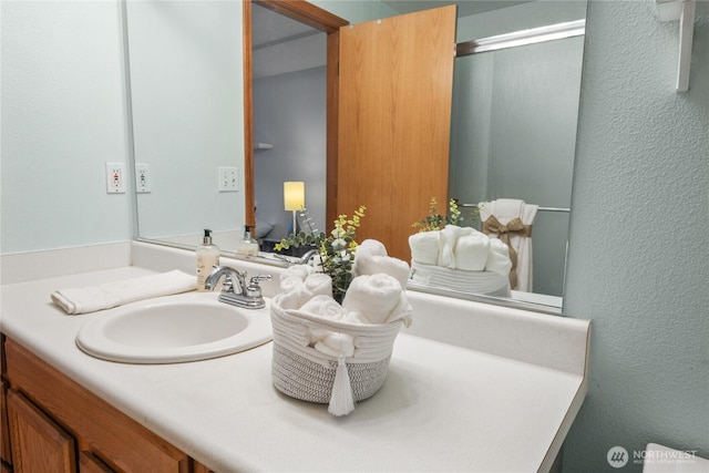 16215 NE 13th St, Vancouver, WA 98684 - full bathroom with vanity, a shower with shower door, and a textured wall