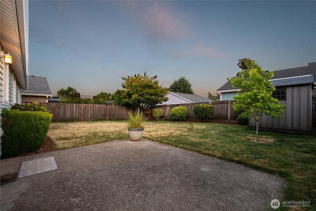 16215 NE 13th St, Vancouver, WA 98684 - yard at dusk with a patio area and a fenced backyard