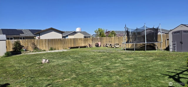 1175 E Cypress St, Othello, WA 99344 - view of yard featuring a trampoline and a residential view