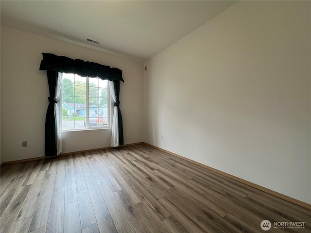 15121 148th St E, Orting, WA 98360 - empty room with wood finished floors and baseboards