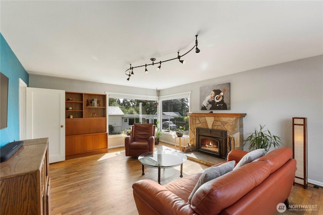 3804 Olympic Blvd W, University Place, WA 98466 - living room with wood finished floors and a stone fireplace