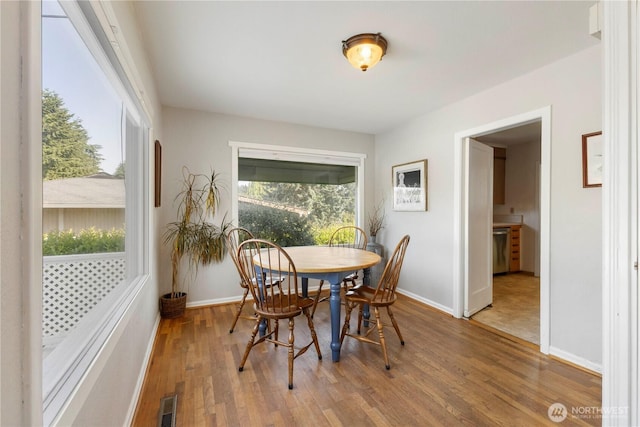 3804 Olympic Blvd W, University Place, WA 98466 - dining area with wood finished floors and baseboards