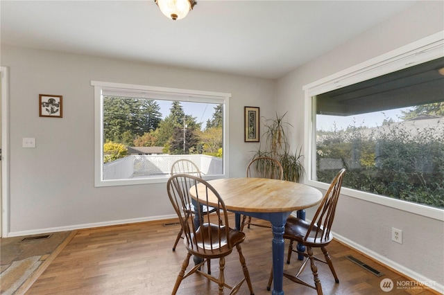 3804 Olympic Blvd W, University Place, WA 98466 - dining area featuring baseboards and wood finished floors