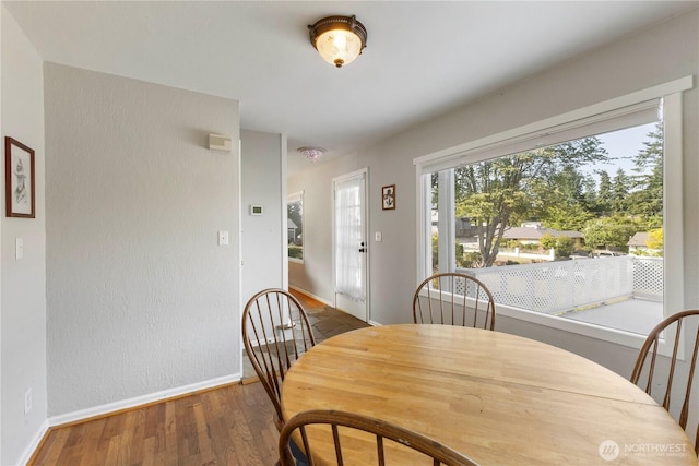 3804 Olympic Blvd W, University Place, WA 98466 - dining room featuring baseboards and wood finished floors
