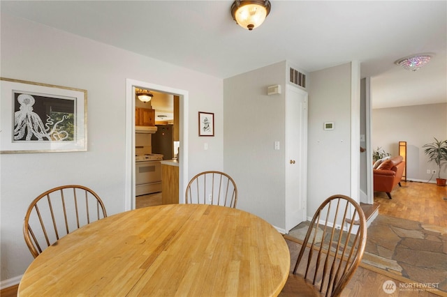 3804 Olympic Blvd W, University Place, WA 98466 - dining room featuring wood finished floors and baseboards