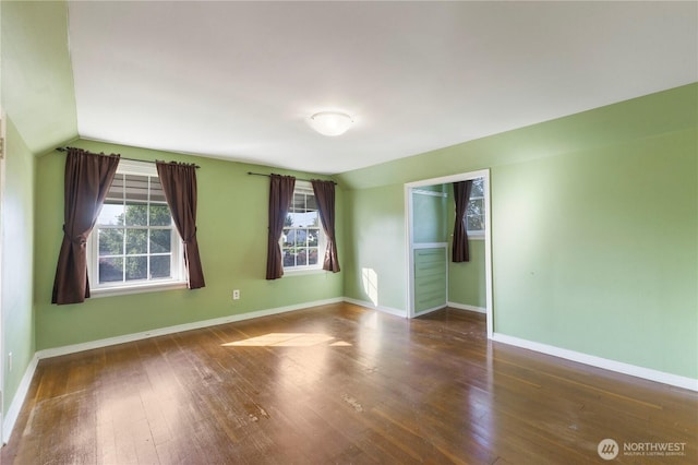 3804 Olympic Blvd W, University Place, WA 98466 - empty room with hardwood / wood-style floors, vaulted ceiling, and baseboards