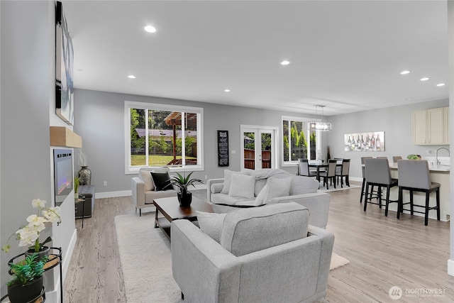 10617 Rosewood Ave Unit A, Everett, WA 98204 - living area with recessed lighting, light wood finished floors, baseboards, and a chandelier