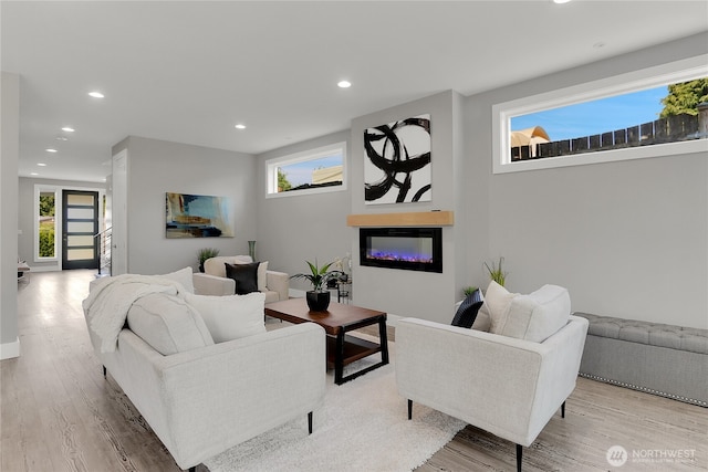 10617 Rosewood Ave Unit A, Everett, WA 98204 - living room with a glass covered fireplace, wood finished floors, recessed lighting, and healthy amount of natural light