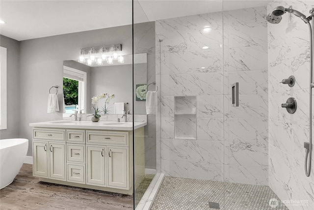 10617 Rosewood Ave Unit A, Everett, WA 98204 - bathroom with a shower stall, double vanity, a freestanding bath, and wood finished floors