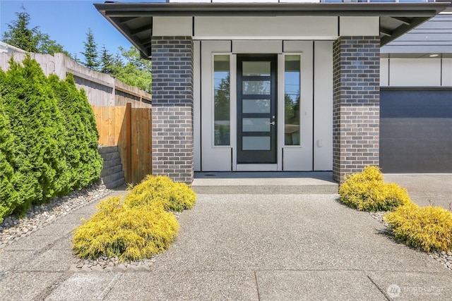 10617 Rosewood Ave Unit A, Everett, WA 98204 - doorway to property featuring brick siding and a garage