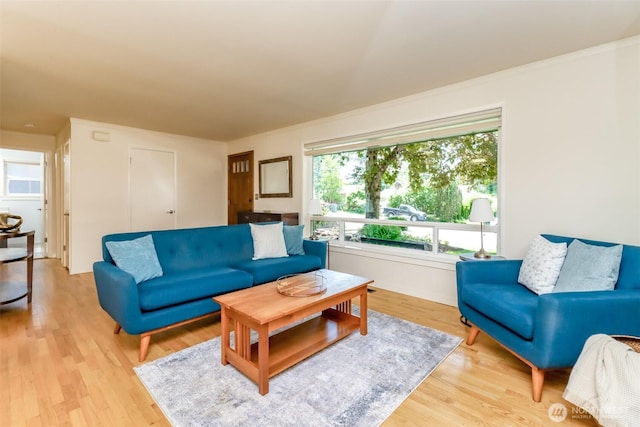 11258 29th Ave SW, Seattle, WA 98146 - living area with light wood-type flooring and ornamental molding