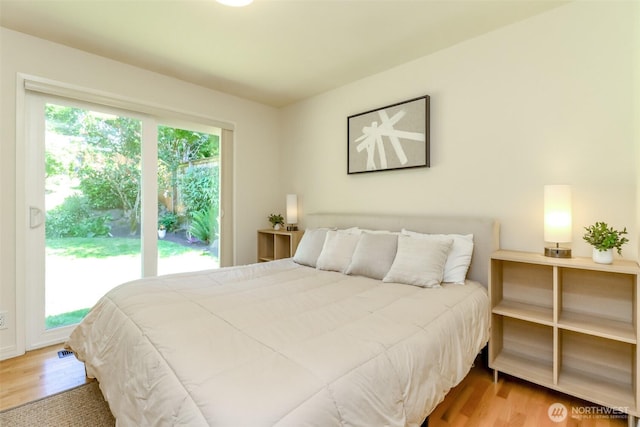 11258 29th Ave SW, Seattle, WA 98146 - bedroom featuring wood finished floors and access to outside