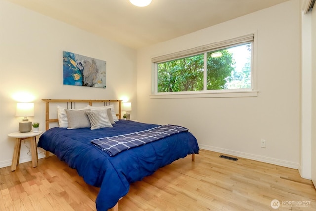 11258 29th Ave SW, Seattle, WA 98146 - bedroom featuring wood finished floors and baseboards