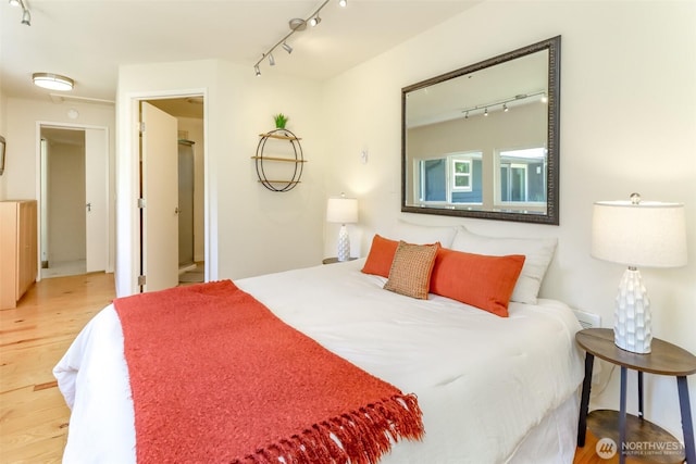 11258 29th Ave SW, Seattle, WA 98146 - bedroom with wood finished floors and rail lighting