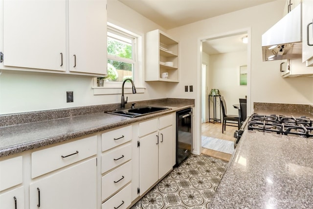 11258 29th Ave SW, Seattle, WA 98146 - kitchen featuring black appliances, a sink, under cabinet range hood, white cabinetry, and dark countertops