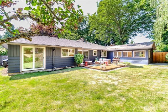 11258 29th Ave SW, Seattle, WA 98146 - rear view of house featuring a chimney, board and batten siding, and a patio area