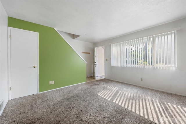2300 9th Ave SW Unit C1, Olympia, WA 98502 - unfurnished living room featuring carpet floors and baseboards