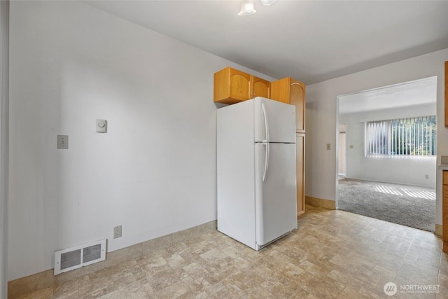 2300 9th Ave SW Unit C1, Olympia, WA 98502 - kitchen featuring freestanding refrigerator and baseboards