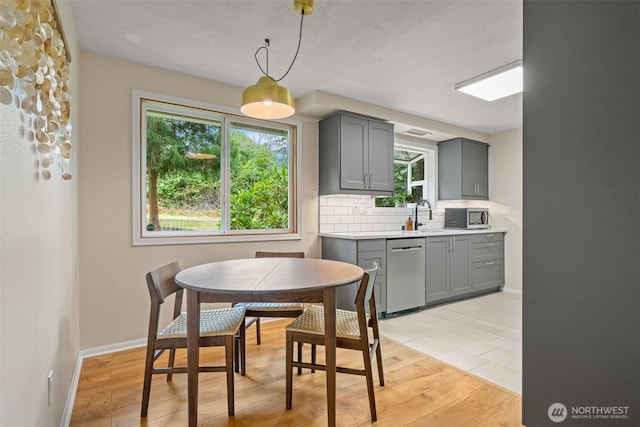 35804 15th Ave SW, Federal Way, WA 98023 - dining area featuring light wood-style floors and baseboards
