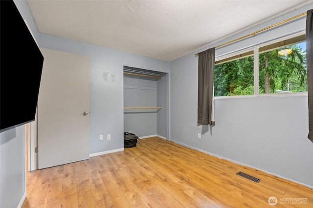 35804 15th Ave SW, Federal Way, WA 98023 - unfurnished bedroom with hardwood / wood-style floors and a closet