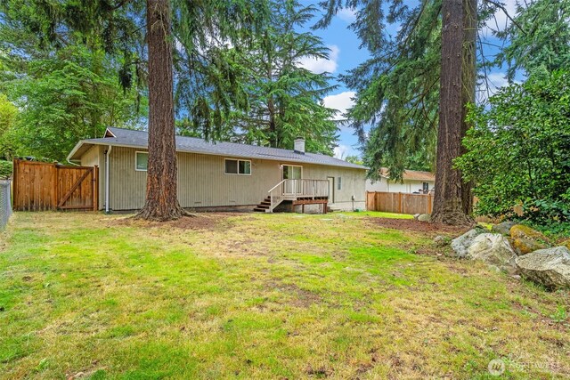 35804 15th Ave SW, Federal Way, WA 98023 - back of property featuring a fenced backyard and a chimney