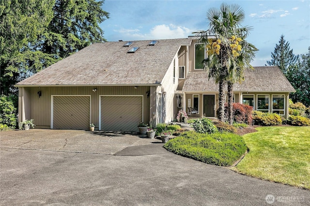 20219 SE 344th St, Auburn, WA 98092 - view of front of house featuring an attached garage, driveway, and a front lawn