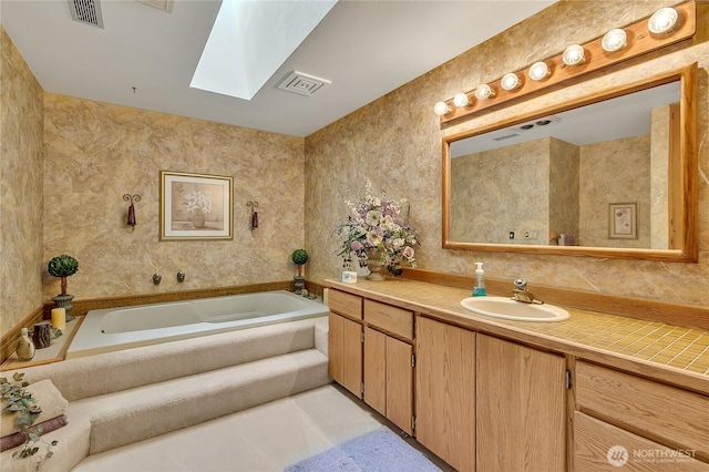 20219 SE 344th St, Auburn, WA 98092 - bathroom with a skylight, vanity, and a bath