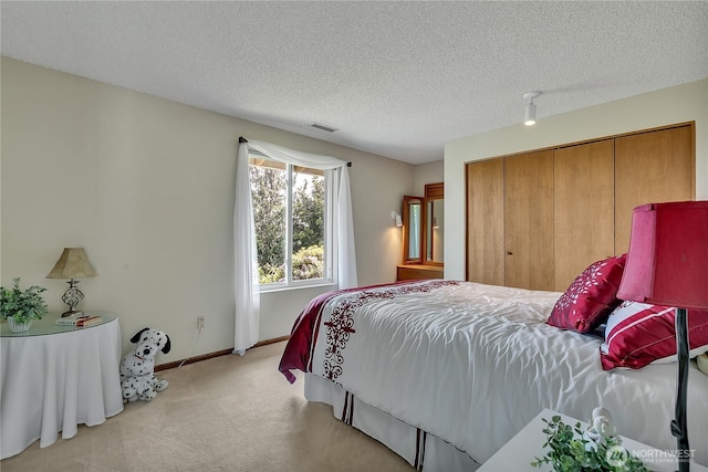 20219 SE 344th St, Auburn, WA 98092 - bedroom featuring light colored carpet, a textured ceiling, baseboards, and a closet