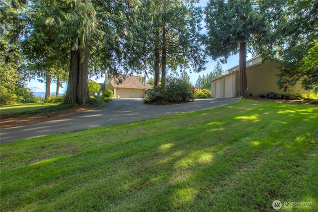 20219 SE 344th St, Auburn, WA 98092 - view of front of home featuring a front lawn and asphalt driveway