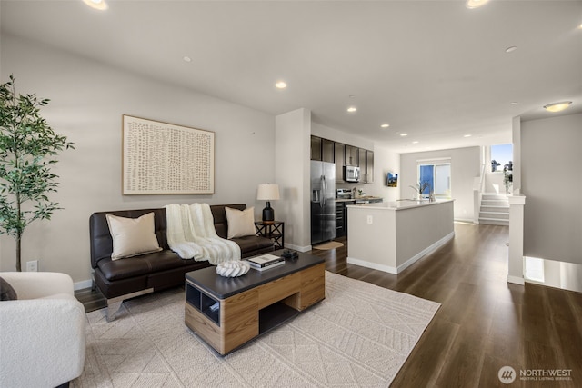 16201 Meadow Rd Unit G2, Lynnwood, WA 98087 - living room featuring baseboards, wood finished floors, recessed lighting, and stairs