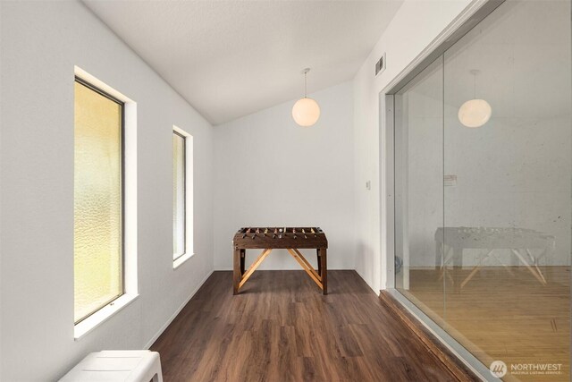 20101 61st Pl W Unit E-308, Lynnwood, WA 98036 - unfurnished dining area with dark wood finished floors and vaulted ceiling