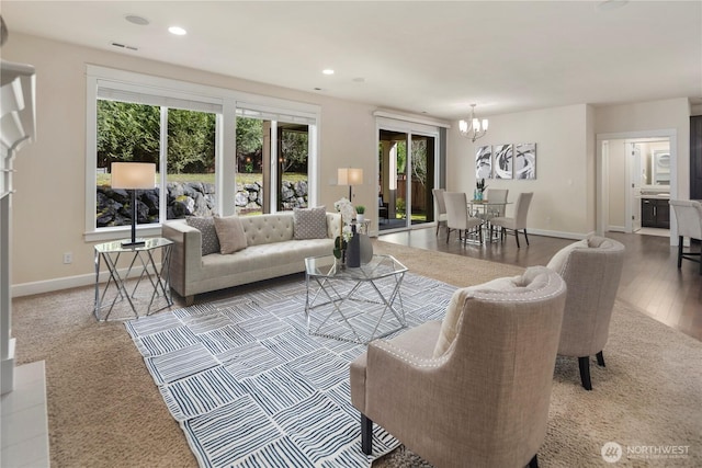 24332 NE 8th Pl, Sammamish, WA 98074 - carpeted living room featuring a chandelier, baseboards, and recessed lighting