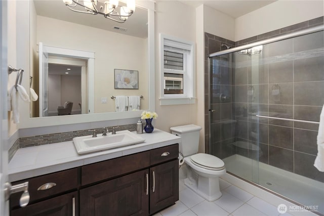 24332 NE 8th Pl, Sammamish, WA 98074 - full bathroom with a chandelier, tile patterned floors, toilet, vanity, and a shower stall