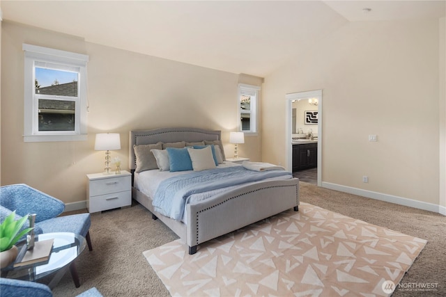24332 NE 8th Pl, Sammamish, WA 98074 - bedroom featuring light colored carpet, baseboards, lofted ceiling, and ensuite bath
