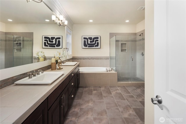 24332 NE 8th Pl, Sammamish, WA 98074 - bathroom featuring a shower stall, a bath, double vanity, recessed lighting, and tile patterned flooring
