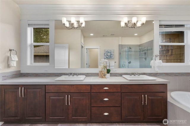 24332 NE 8th Pl, Sammamish, WA 98074 - full bath with a chandelier, double vanity, a shower stall, and a bath