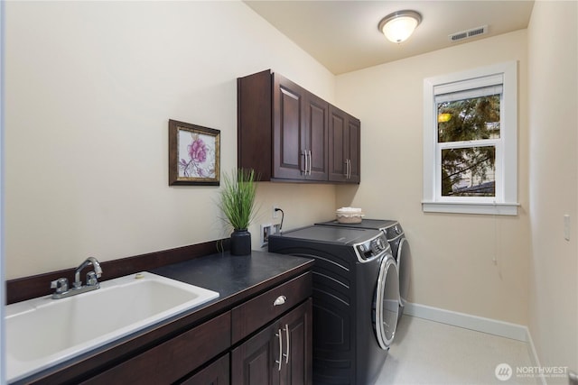 24332 NE 8th Pl, Sammamish, WA 98074 - laundry area with cabinet space, washing machine and dryer, and baseboards