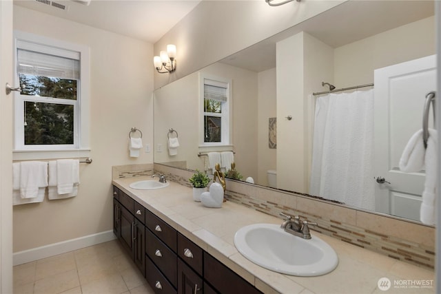 24332 NE 8th Pl, Sammamish, WA 98074 - full bath with baseboards, double vanity, toilet, tile patterned flooring, and a shower with curtain