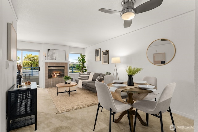 2244 13th Ave W Unit 106, Seattle, WA 98119 - dining room with a fireplace and a ceiling fan