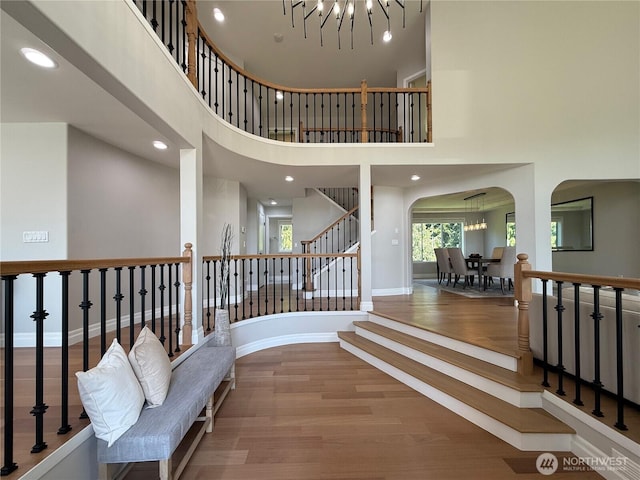1621 Edgemoor Ln, Everett, WA 98203 - entryway featuring wood finished floors, a towering ceiling, arched walkways, baseboards, and recessed lighting