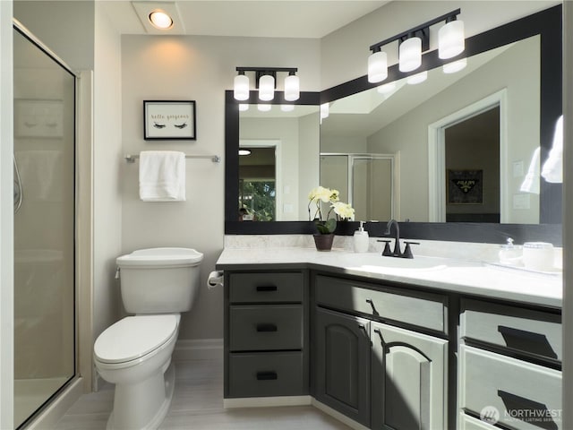 1621 Edgemoor Ln, Everett, WA 98203 - bathroom with vanity, toilet, a shower stall, and baseboards
